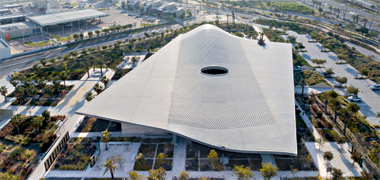 An oblique aerial view of the Mujadilah mosque looking west – photography by Iwan Baan, courtesy of DS+R Architects